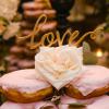 ♥This couple did the prettiest doughnut cake, and we did the topper to match the event...the sweetest gold script "love" topper.
-Photo: Tim Otto